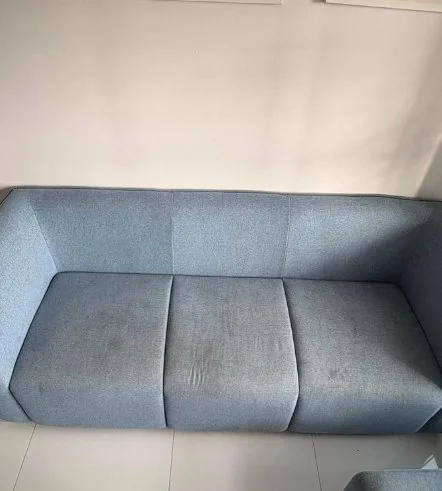 Blue sofa before cleaning