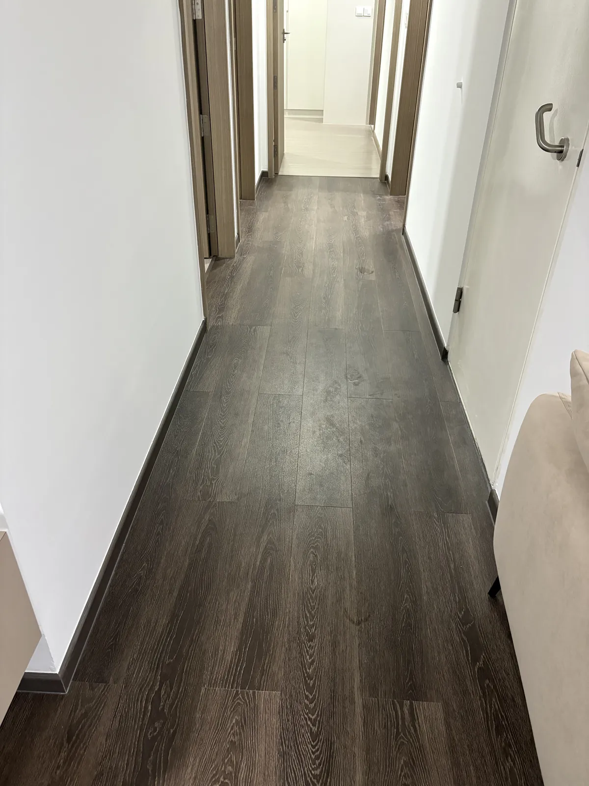 Dark vinyl corridor floor after deep cleaning